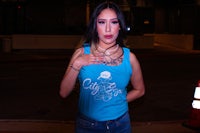 a woman wearing a blue tank top
